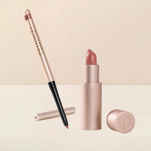 Sculpt and Hydrate Lip Duo by Lenoites featuring a Tinted Lip Balm in color bloom, a Shape & Sculpt Lip Liner in color blush, elegantly arranged on a light beige background.