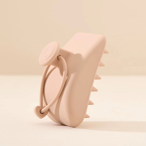Hair Scalp Silicon Massager by Lenoites, featuring a soft pink silicon massager with a handle, designed to gently massage the scalp, displayed against a soft beige background.