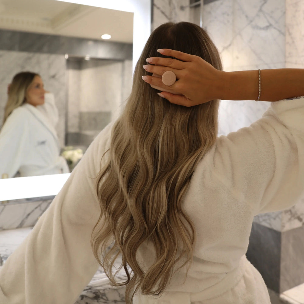 Hair Scalp Silicon Massager by Lenoites, featuring a soft pink silicon massager with a handle, designed to gently massage the scalp, displayed against a soft beige background.