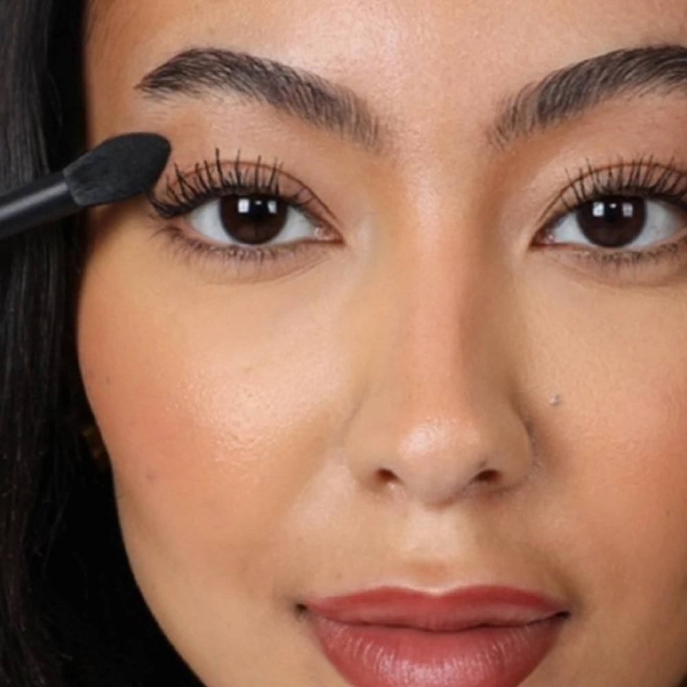 Brush Me Tapered Blender Brush No. 102 by Lenoites, featuring a black handle and a tapered brush head, displayed against a soft beige background.